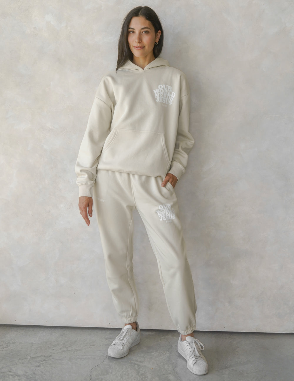 Our World Needs Jesus Beige Unisex Sweatpants